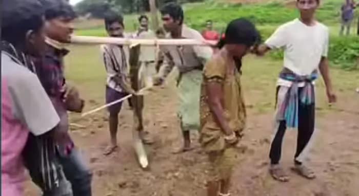নবদম্পতিকে বলদের মতো জোয়ালের সঙ্গে বেঁধে ঘোরানো হল চাষের খেতে